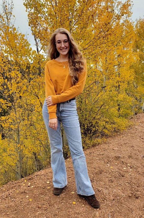 Student in front of tree changing colors
